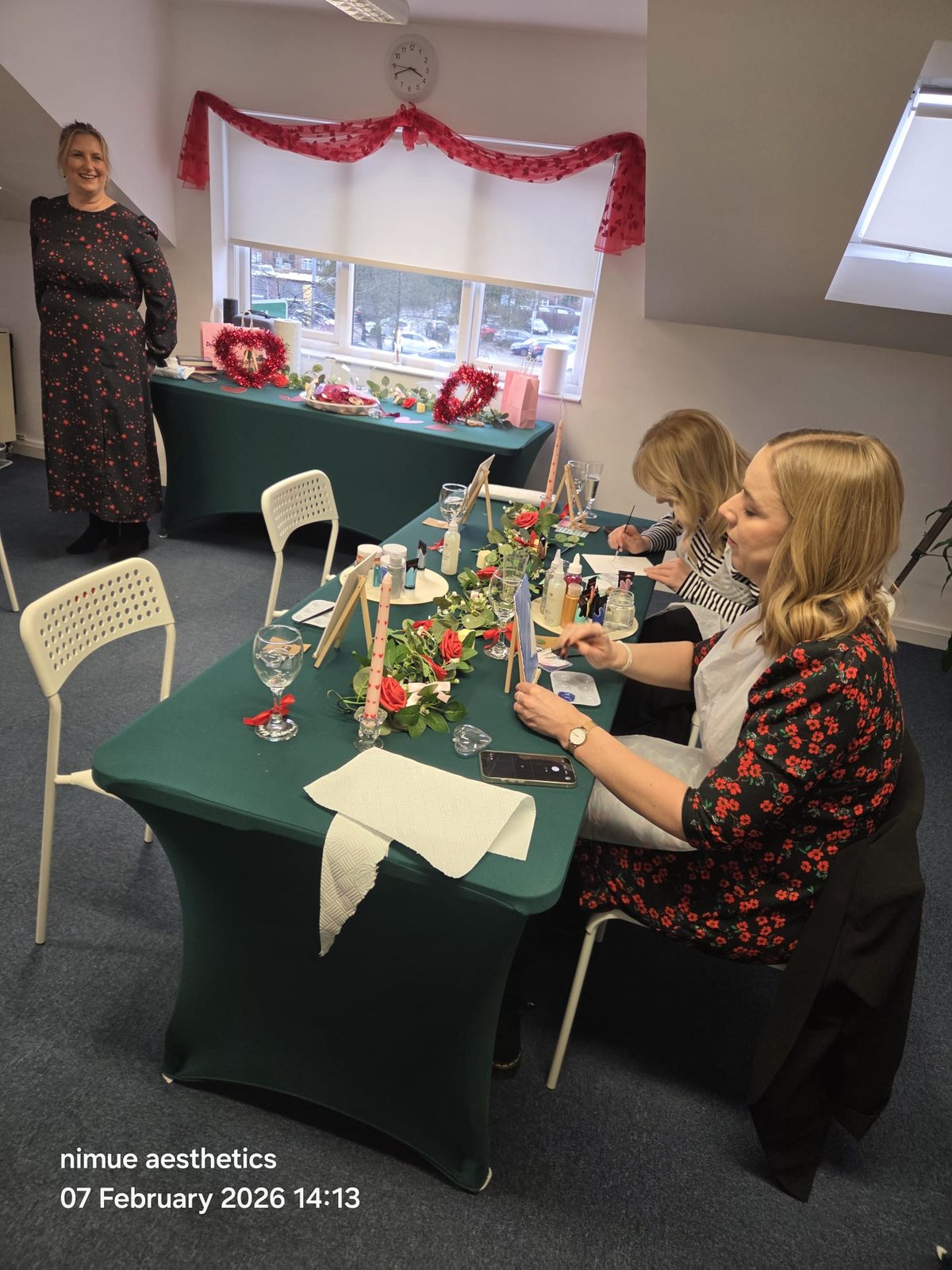 Guests painting canvases during Galentine's Paint and Sip