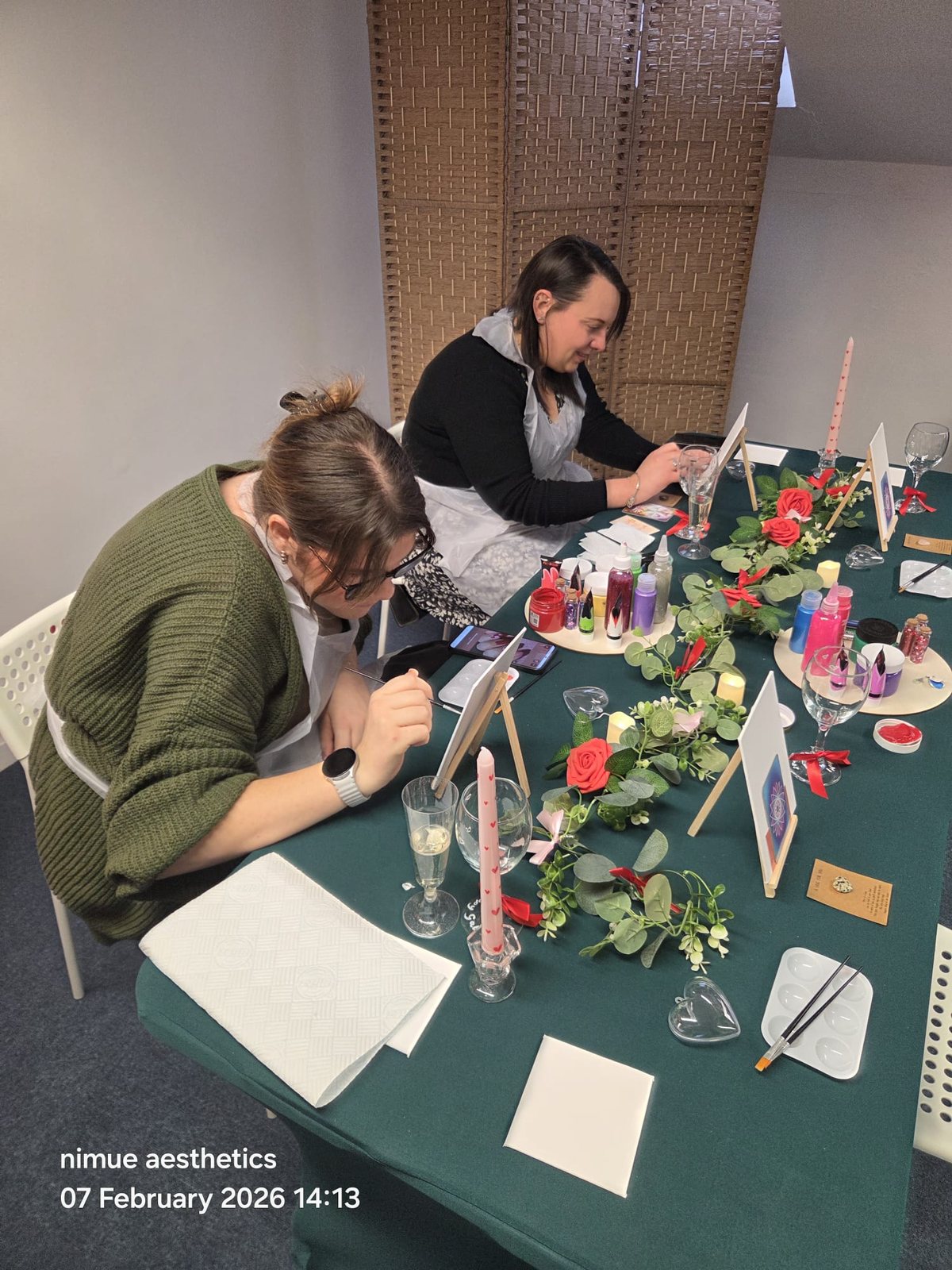 Guests enjoying a Galentine's Paint and Sip workshop