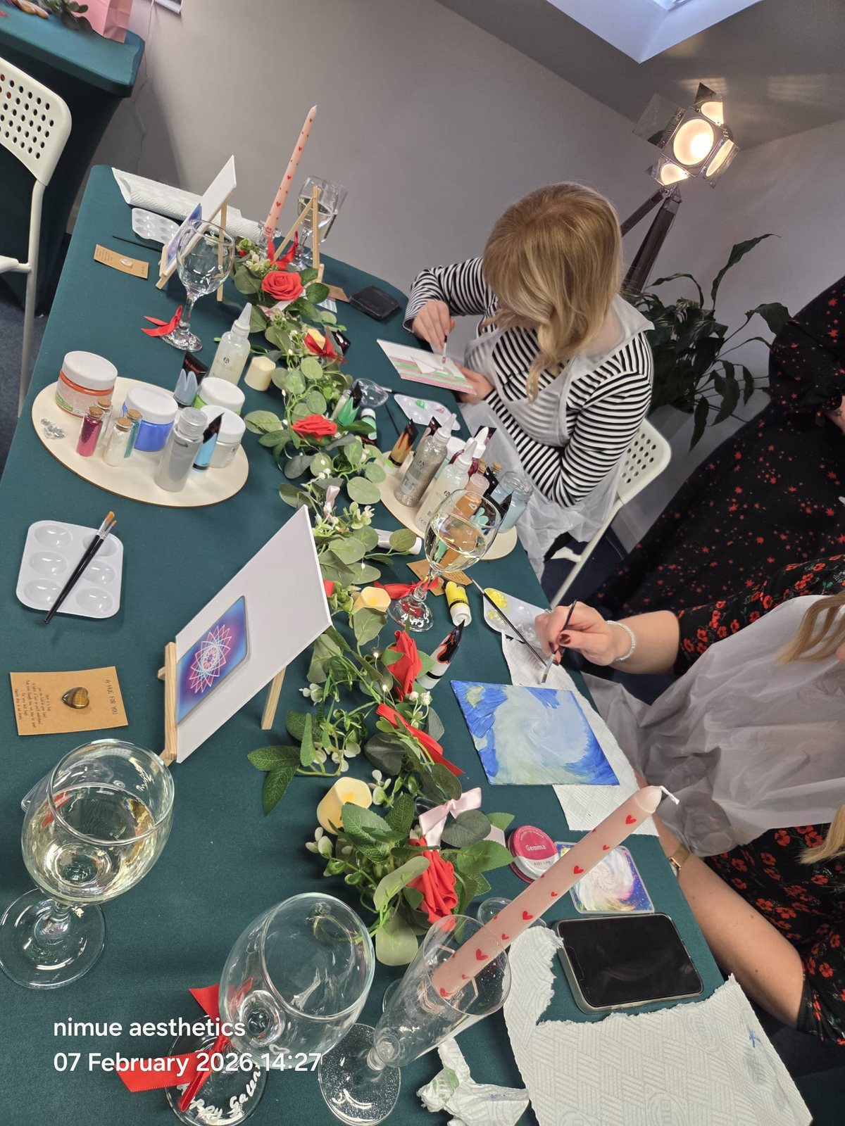 Guests painting together during the Galentine's creative workshop
